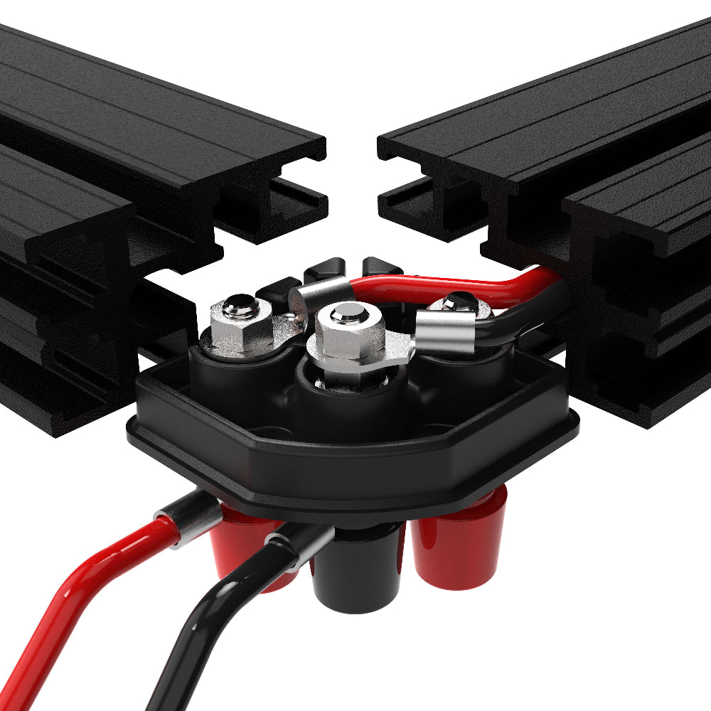 Close-up of a battery connection with black metal connectors and red and black cables on a white background.