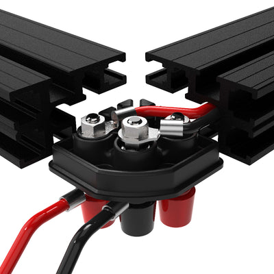 Close-up of a battery connection with black metal connectors and red and black cables on a white background.
