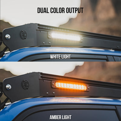 Dual color output LED light bar showing white and amber lights on a vehicle roof.