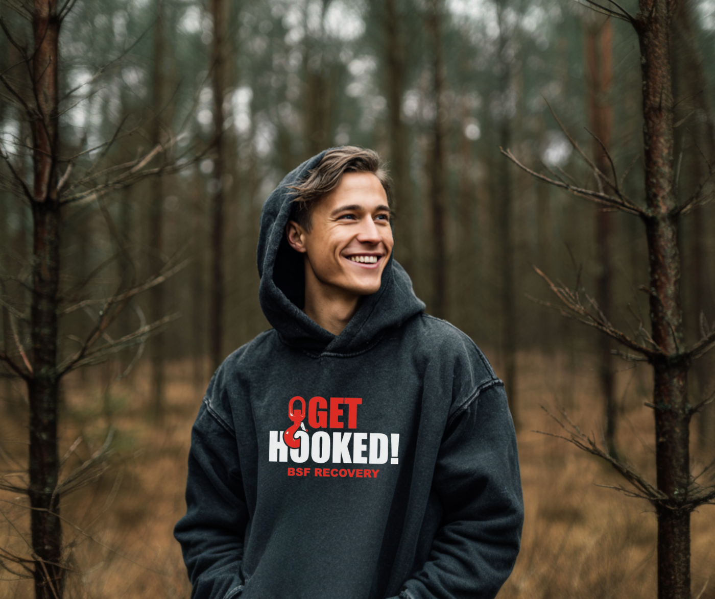 Person wearing a hoodie with 'Get Hooked! GOP Recovery' text in a forest setting