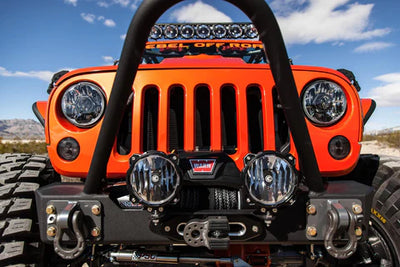 Orange KC Jeep with KC Lights