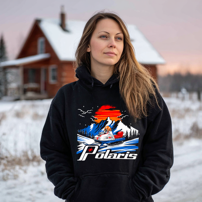 Woman wearing a black hoodie with Polaris graphic in a snowy landscape