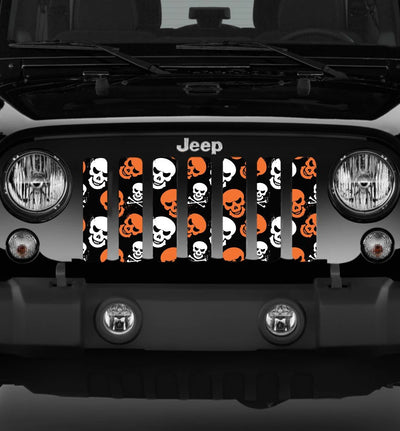 Jeep grille with Halloween-themed design featuring skulls and crossbones on a black background.