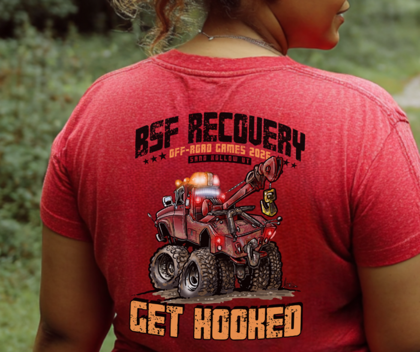 Red t-shirt with 'BSF Recovery' and off-road vehicle graphic on the back, worn by a person outdoors.