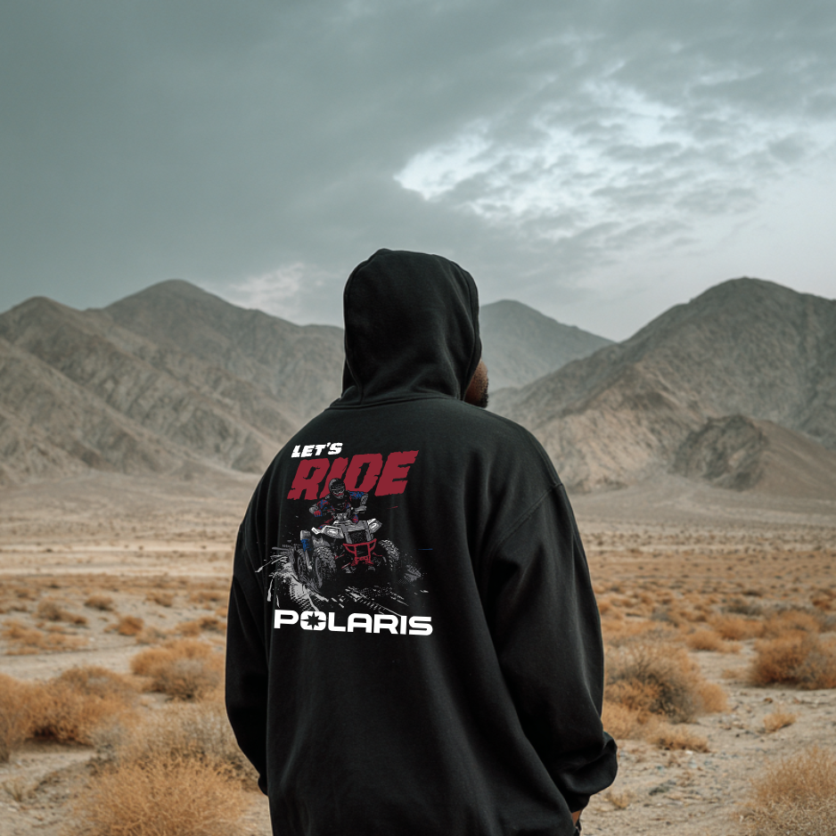 Person wearing a black hoodie with Polaris branding in a desert landscape