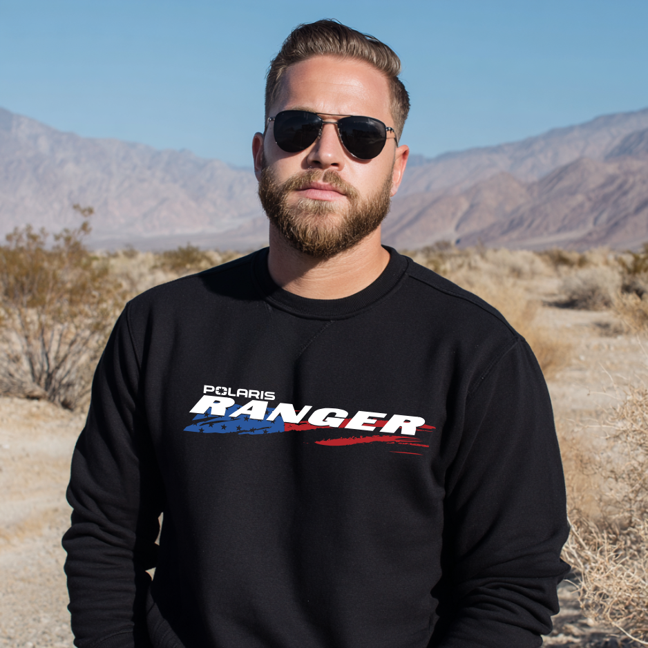Man wearing a black Polaris Ranger sweatshirt in a desert setting