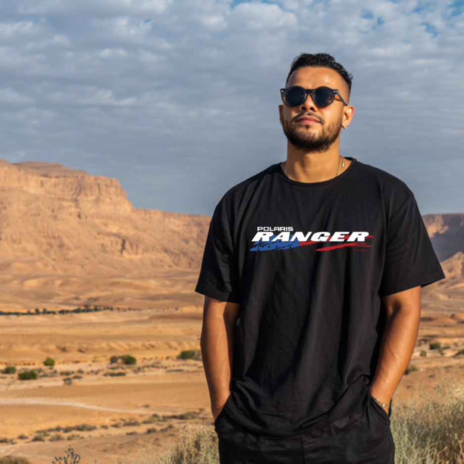 Man wearing a black Polaris Ranger t-shirt in a desert landscape