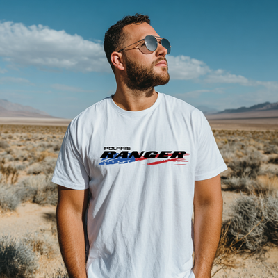 Man wearing a white t-shirt with Polaris Ranger logo in a desert landscape