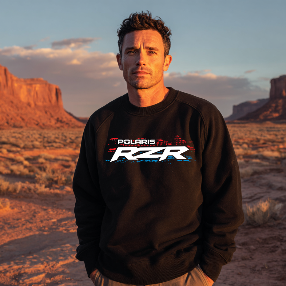 Man wearing a Polaris RZR sweatshirt in a desert landscape