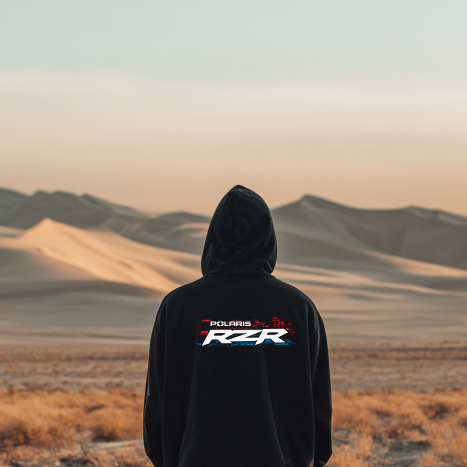 Person wearing a black hoodie with Polaris RZR logo in a desert landscape