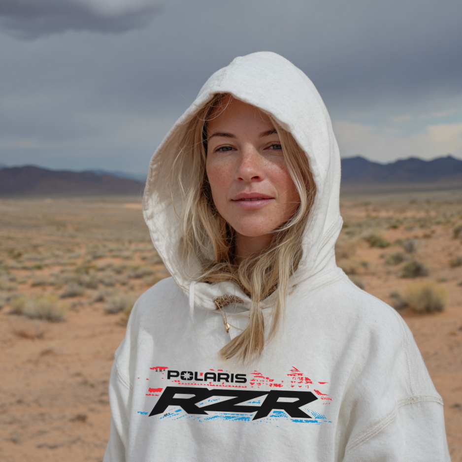 Person wearing a Polaris RZR hoodie in a desert landscape