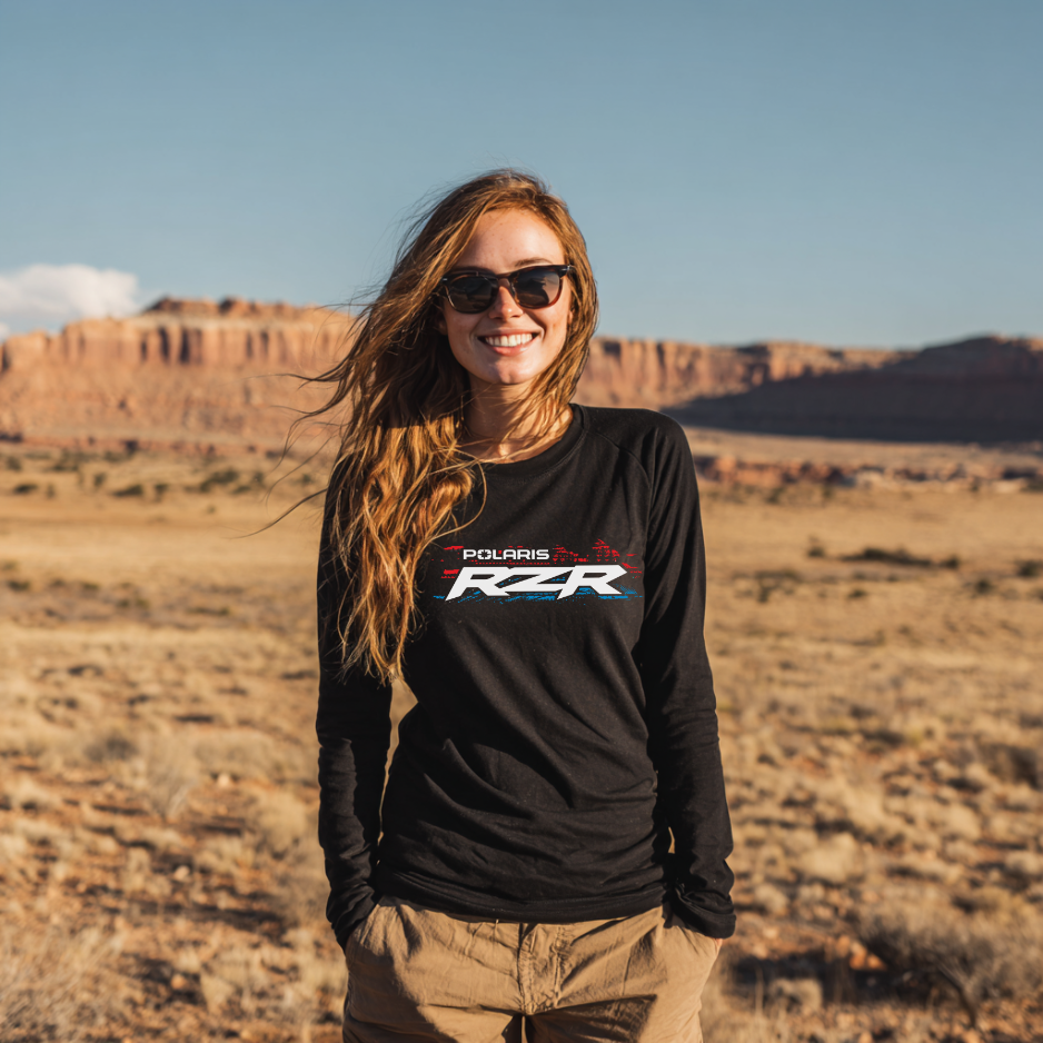 Woman wearing a Polaris RZR shirt in a desert landscape