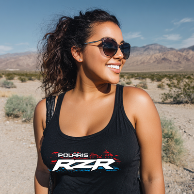 Woman wearing a black tank top with Polaris RZR logo in a desert setting