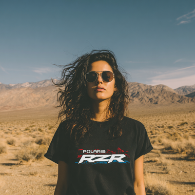 Person wearing a Polaris RZR shirt in a desert landscape