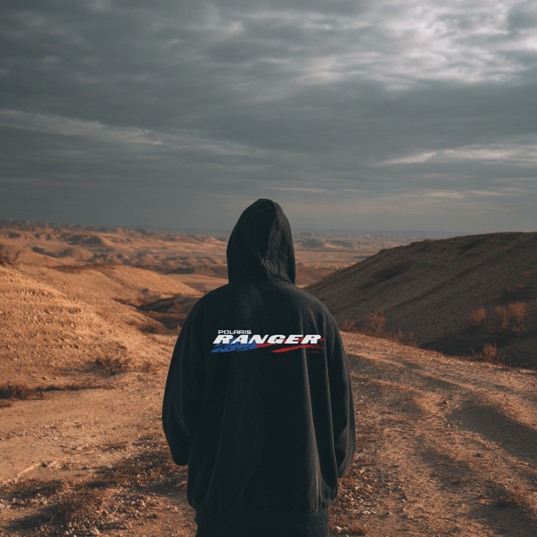 Person wearing a hoodie with 'Ford Ranger' logo in a desert landscape