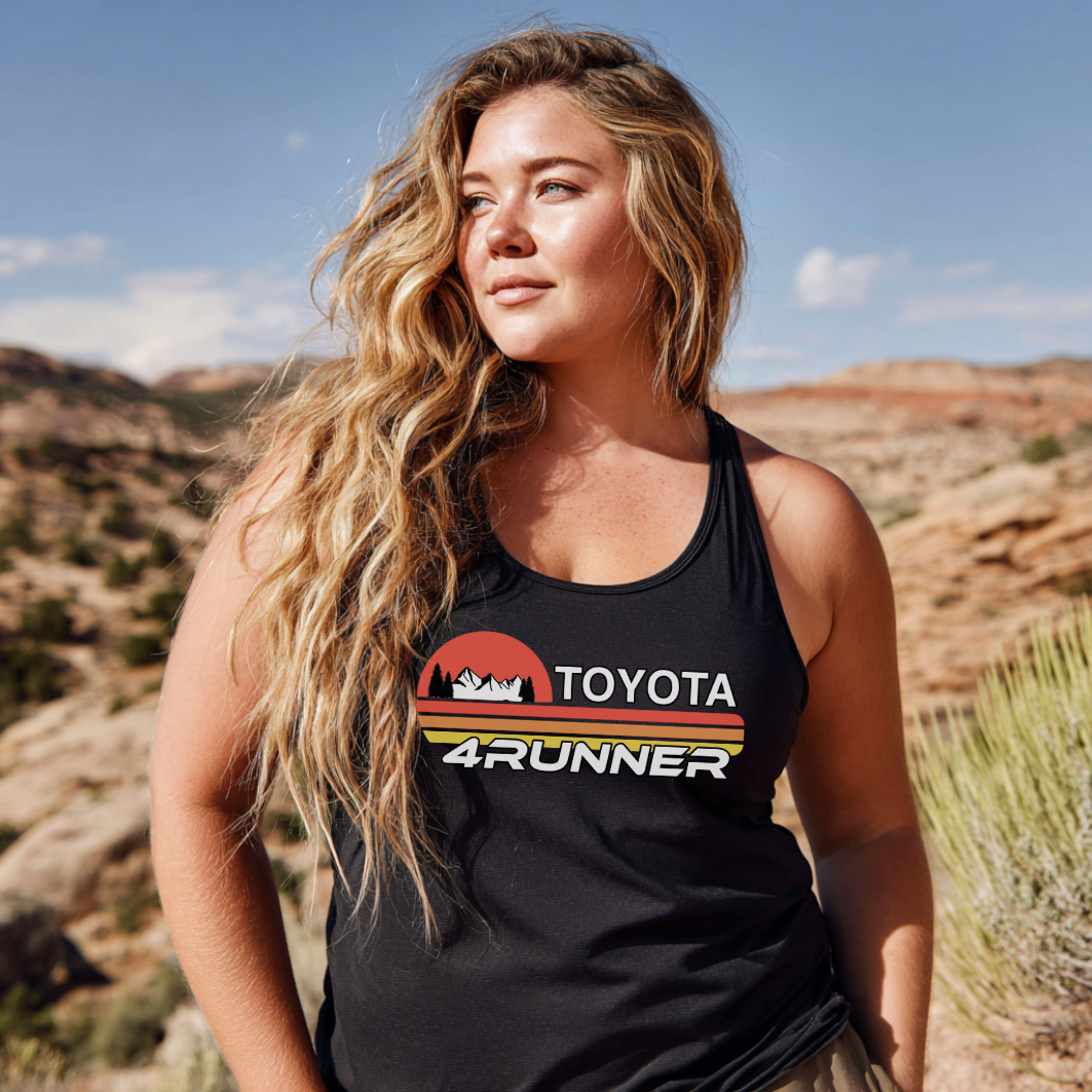 Woman wearing a black Toyota 4Runner tank top in a desert landscape