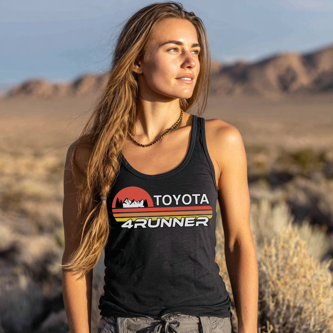 Woman wearing a black Toyota 4Runner tank top in a desert landscape